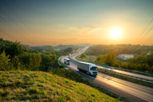 Trucks on the highway at sunset - how do truck accident claims differ from car accident claims?