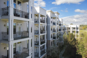 blocks of apartments are shown on a clear sunny day