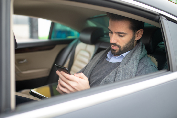 Passenger in a car using his phone - How much can a passenger get in a car accident?
